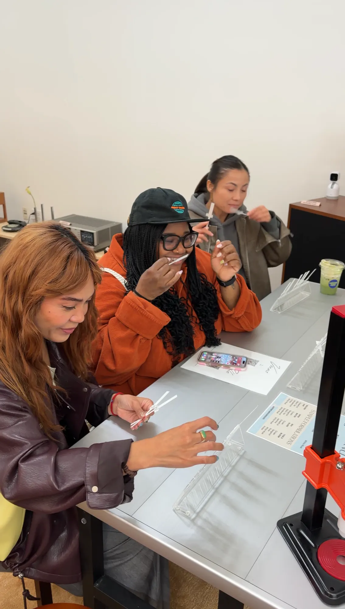 Guests smelling and testing fragrance strips at a workshop